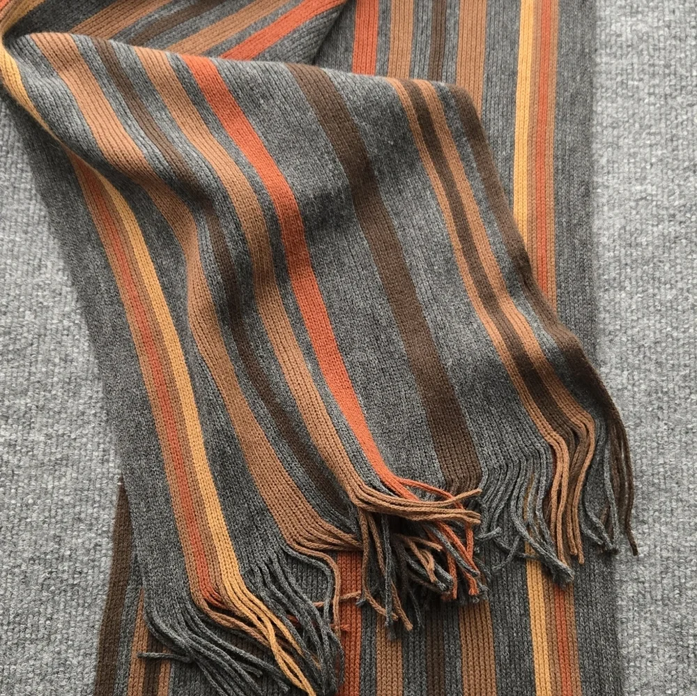 Womens‎ Scarf featuring multicolor stripes and fringe ends. Perfect Pop Of Color